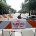 A "no parking" sign is seen marking a barricade set across E. Liberty St. at Fifth Ave. for artists and vendors to setup for the Ann Arbor Art Fair. Melanie Maxwell | AnnArbor.com